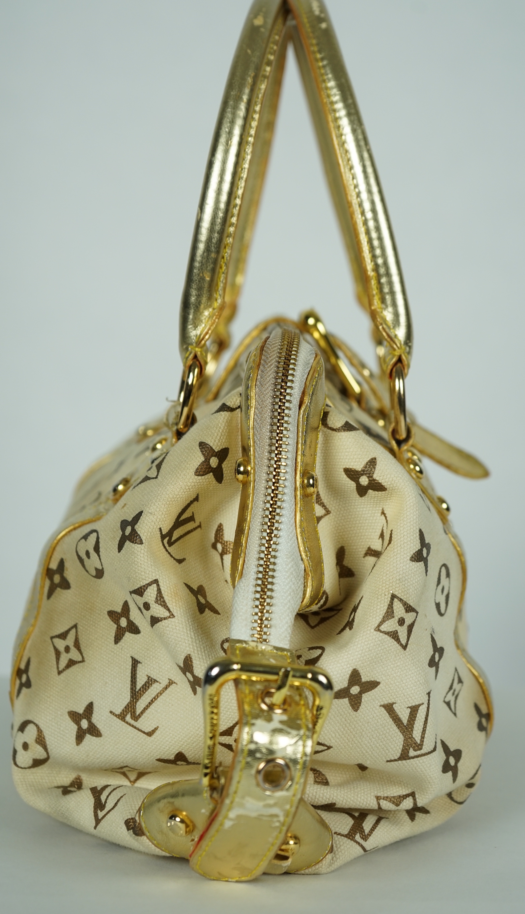 A vintage Louis Vuitton Theda beige and brown Monogram bag